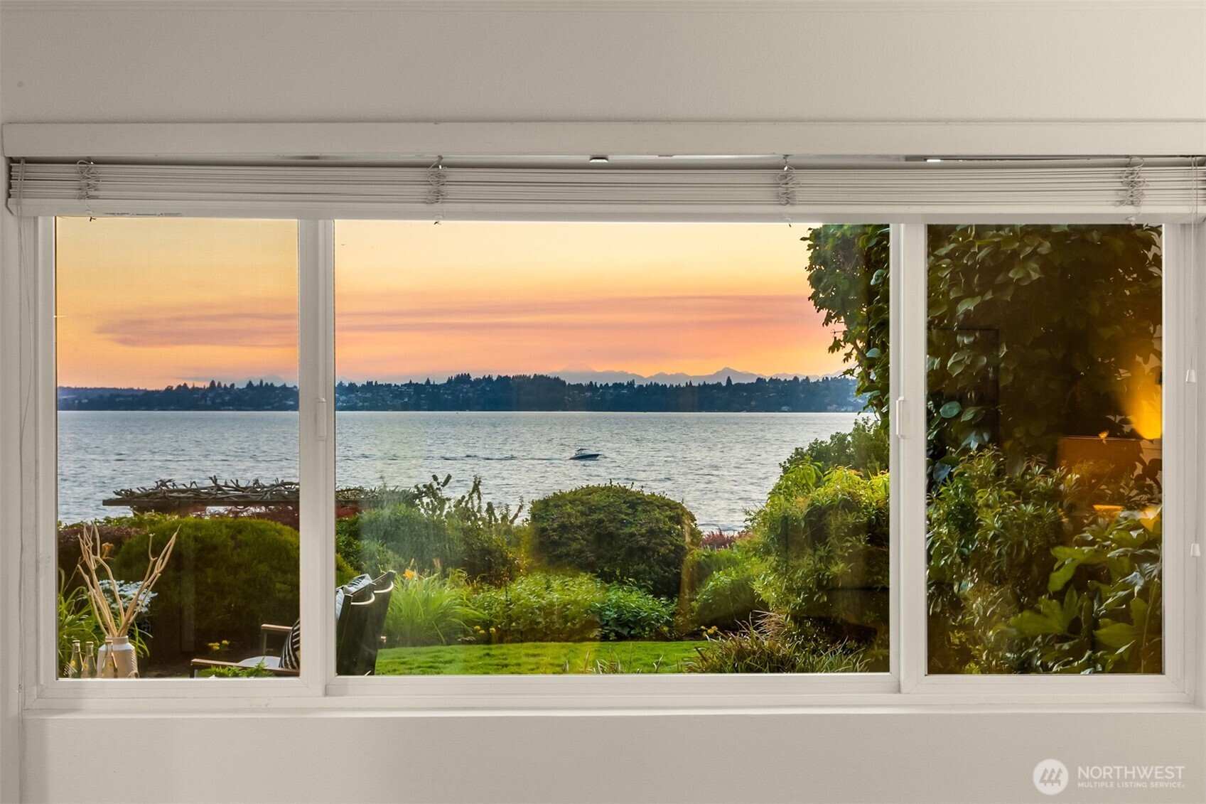 6620 Lake Washington Boulevard Northeast, Unit 101 Kirkland, WA 98033 - Photo 15 of 31 a view of a glass door and a yard from a window