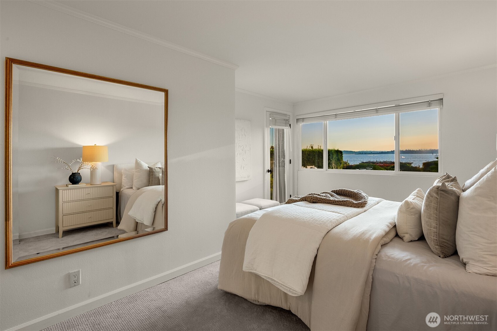 6620 Lake Washington Boulevard Northeast, Unit 101 Kirkland, WA 98033 - Photo 16 of 31 a bedroom with a bed and a large mirror
