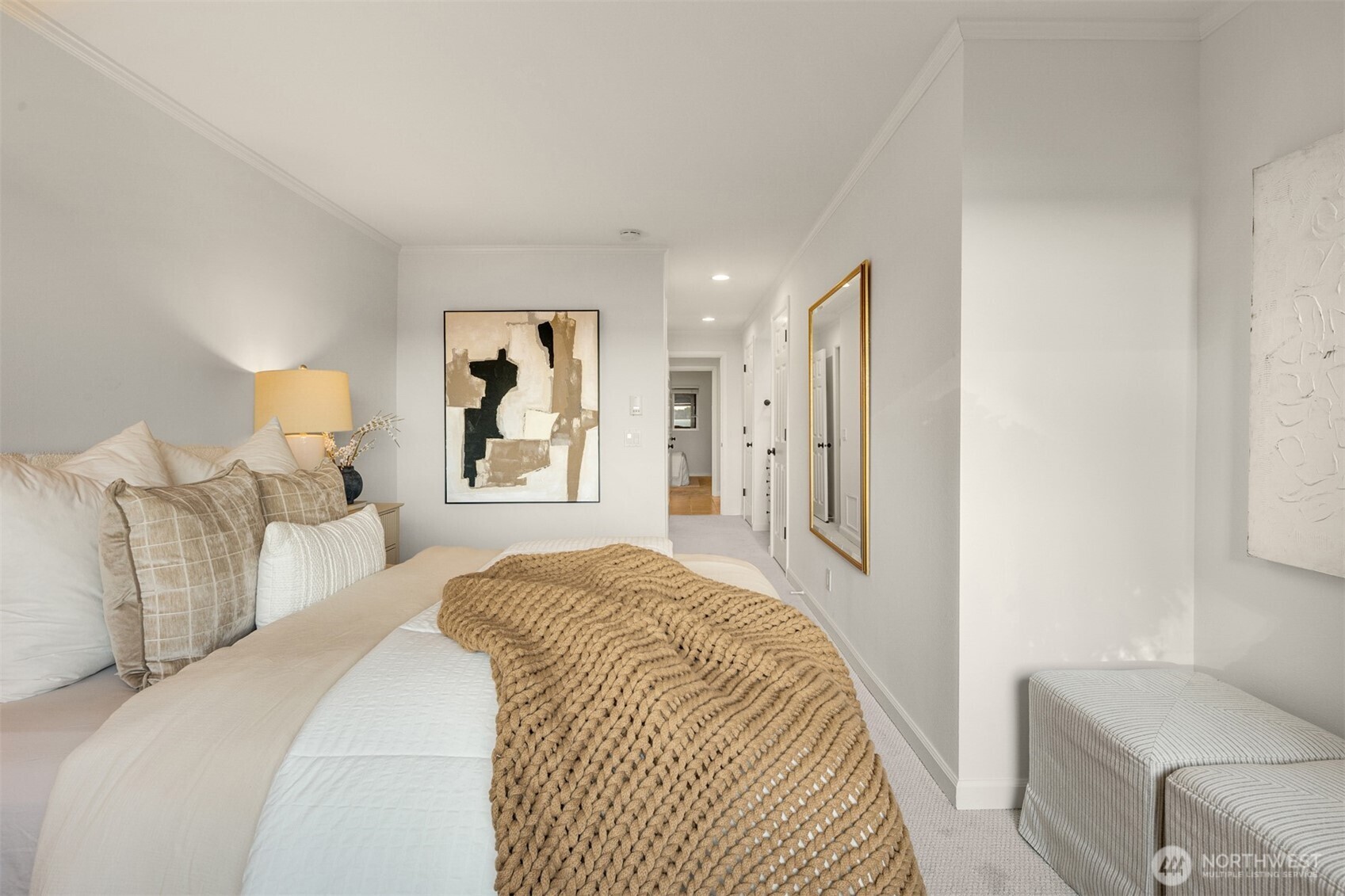 6620 Lake Washington Boulevard Northeast, Unit 101 Kirkland, WA 98033 - Photo 18 of 31 a bedroom with a bed and a couch