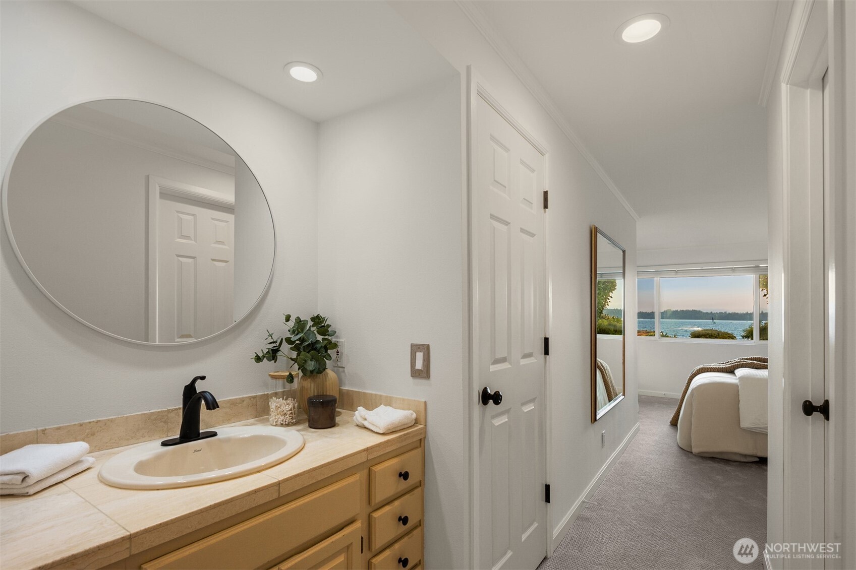 6620 Lake Washington Boulevard Northeast, Unit 101 Kirkland, WA 98033 - Photo 19 of 31 a en suite bathroom with a double vanity sink and a mirror