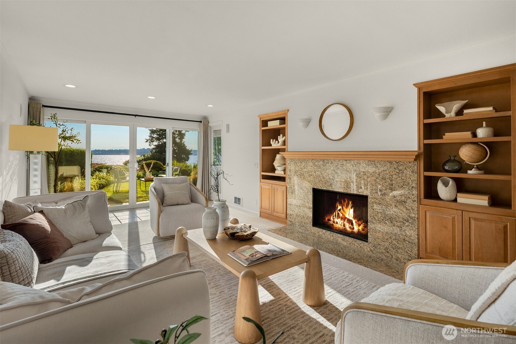 6620 Lake Washington Boulevard Northeast, Unit 101 Kirkland, WA 98033 - Photo 7 of 31 a living room with furniture and a fireplace