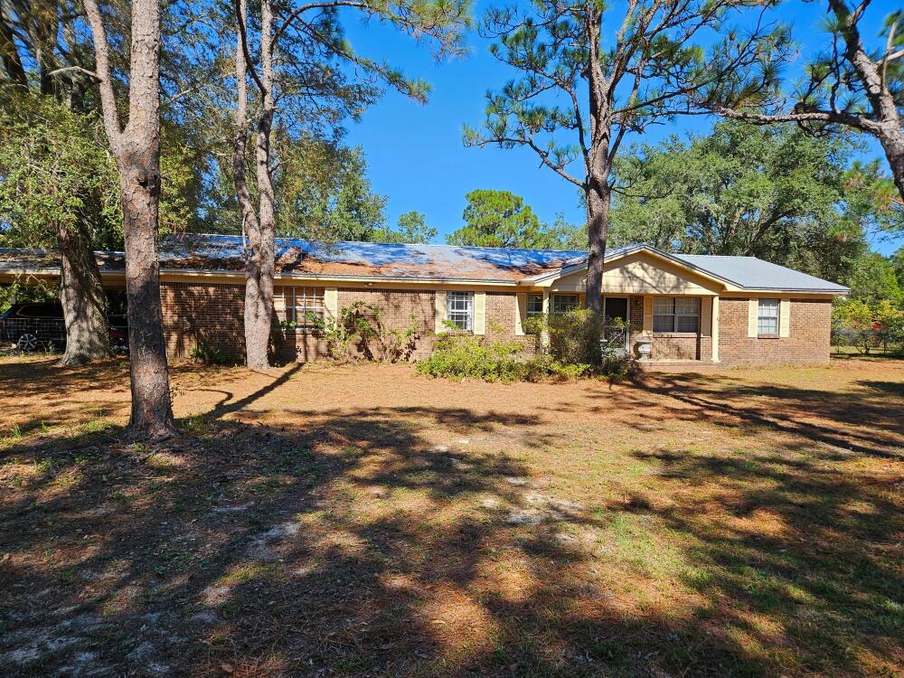 4017 Bear Creek Road Crestview, FL 32539 - Photo 2 of 28 a view of a house with a yard