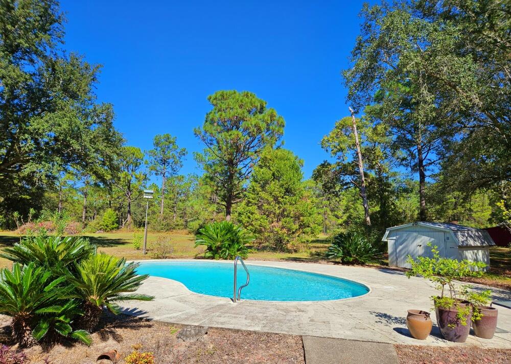 4017 Bear Creek Road Crestview, FL 32539 - Photo 22 of 28 a view of a backyard