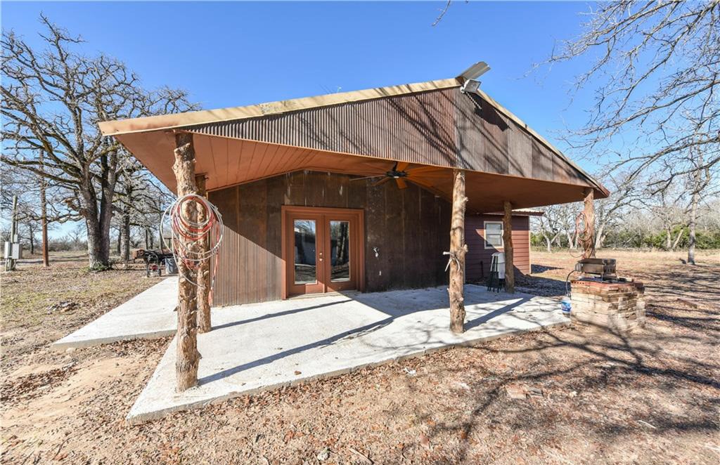 12200 Winn Road Franklin, TX 77856 - Photo 16 of 33 a view of a house with backyard and a tree