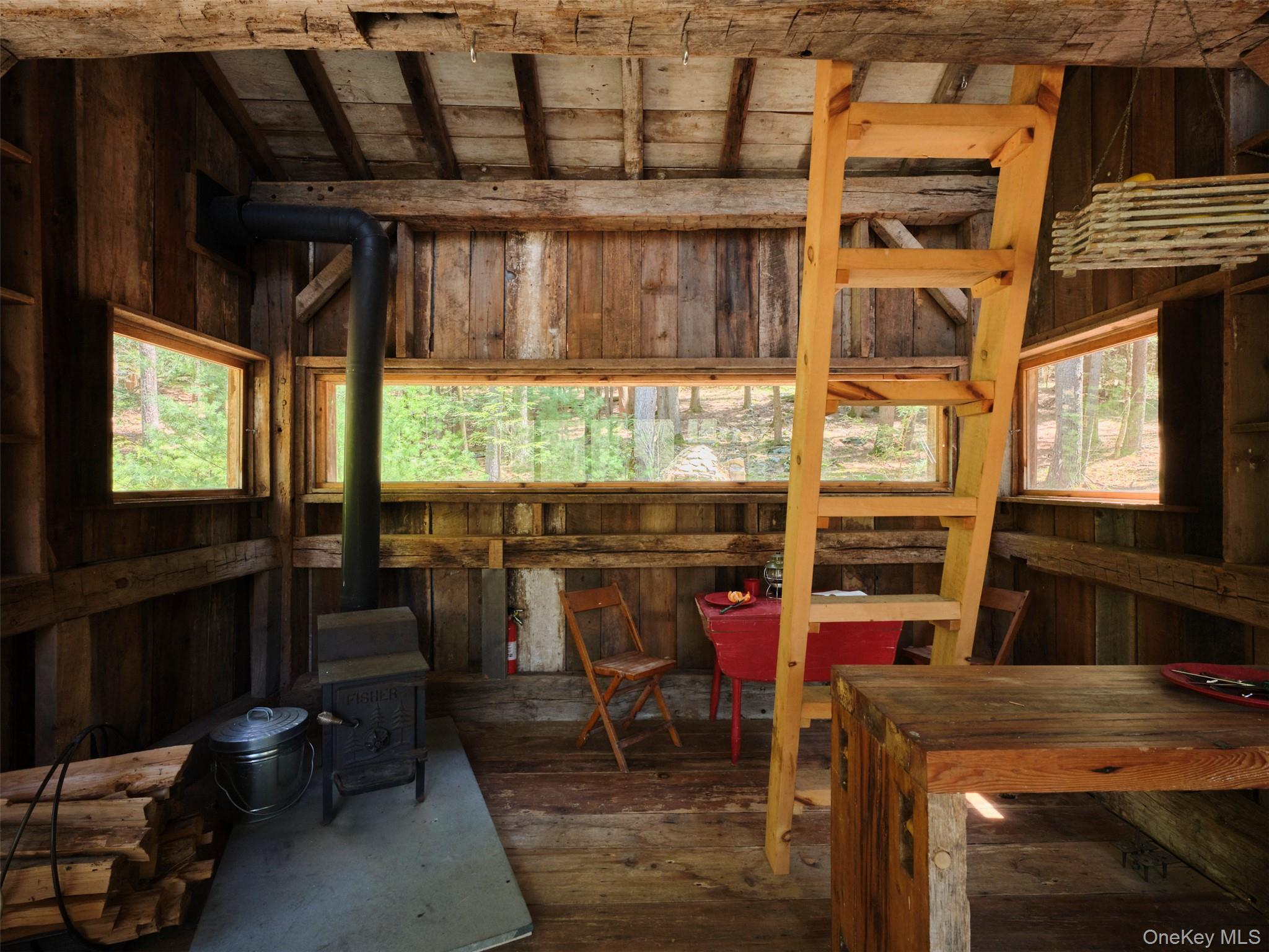 55 Woods Road Barryville, NY 12719 - Photo 50 of 50 a view of a dining room with furniture window and outside view