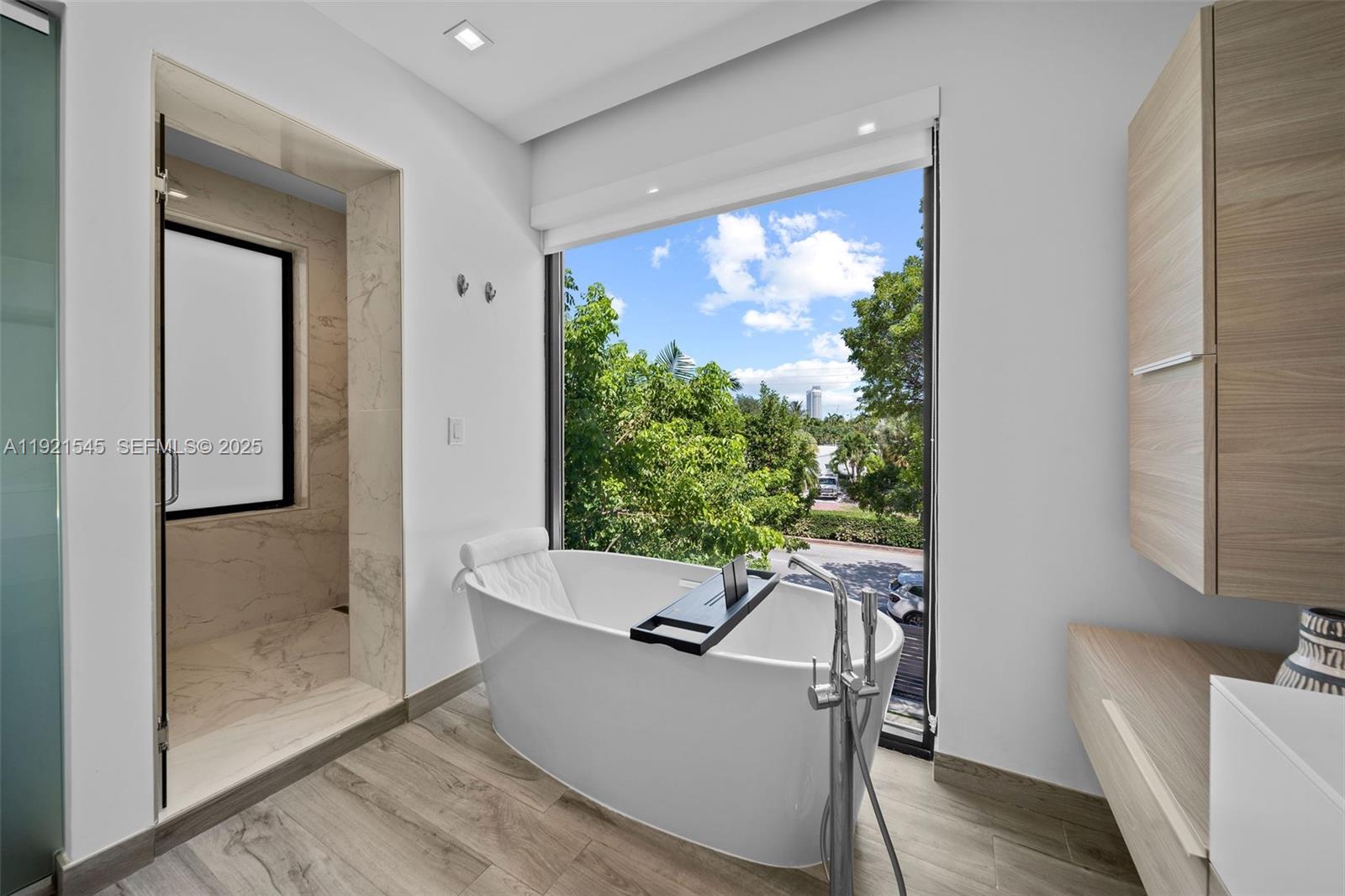 4740 Alton Road Miami Beach, FL 33140 - Photo 17 of 34 a view of a living room and a window