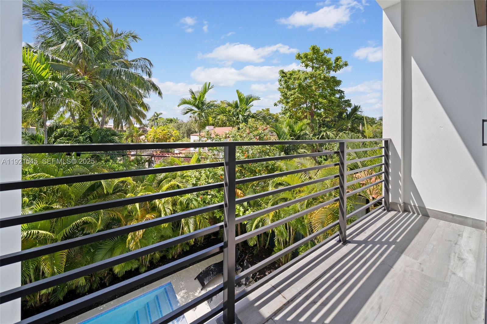 4740 Alton Road Miami Beach, FL 33140 - Photo 25 of 34 a view of a balcony with wooden floor