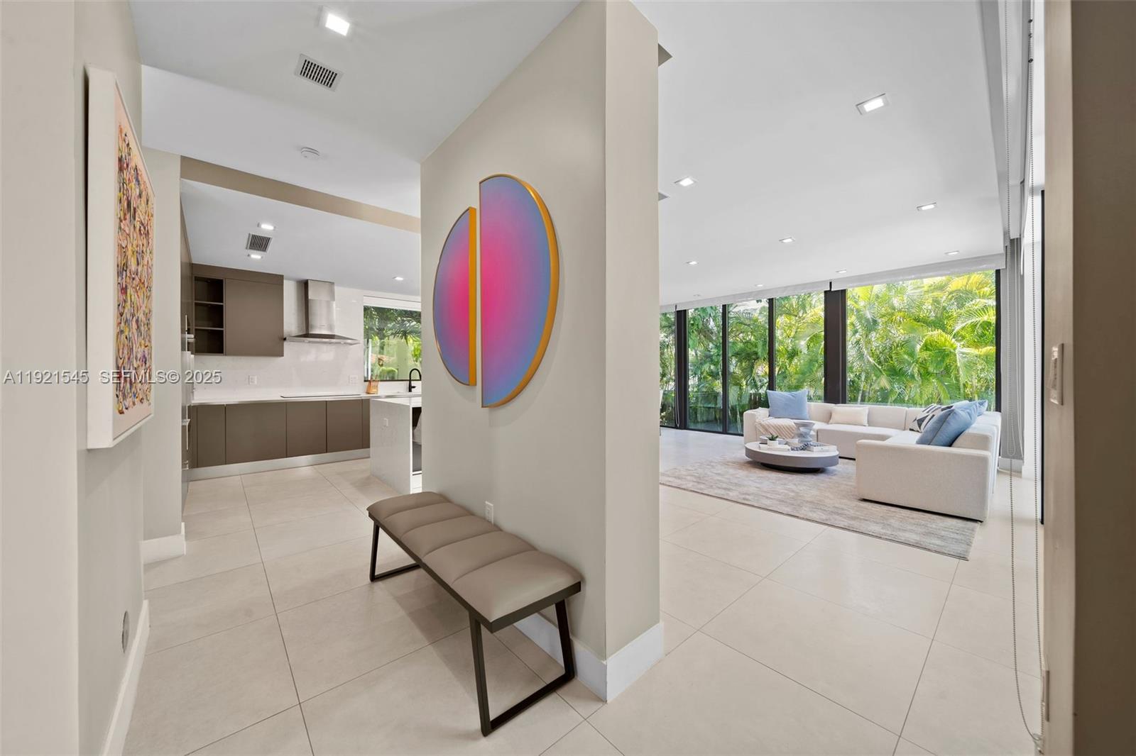 4740 Alton Road Miami Beach, FL 33140 - Photo 30 of 34 a living room with furniture and a large window