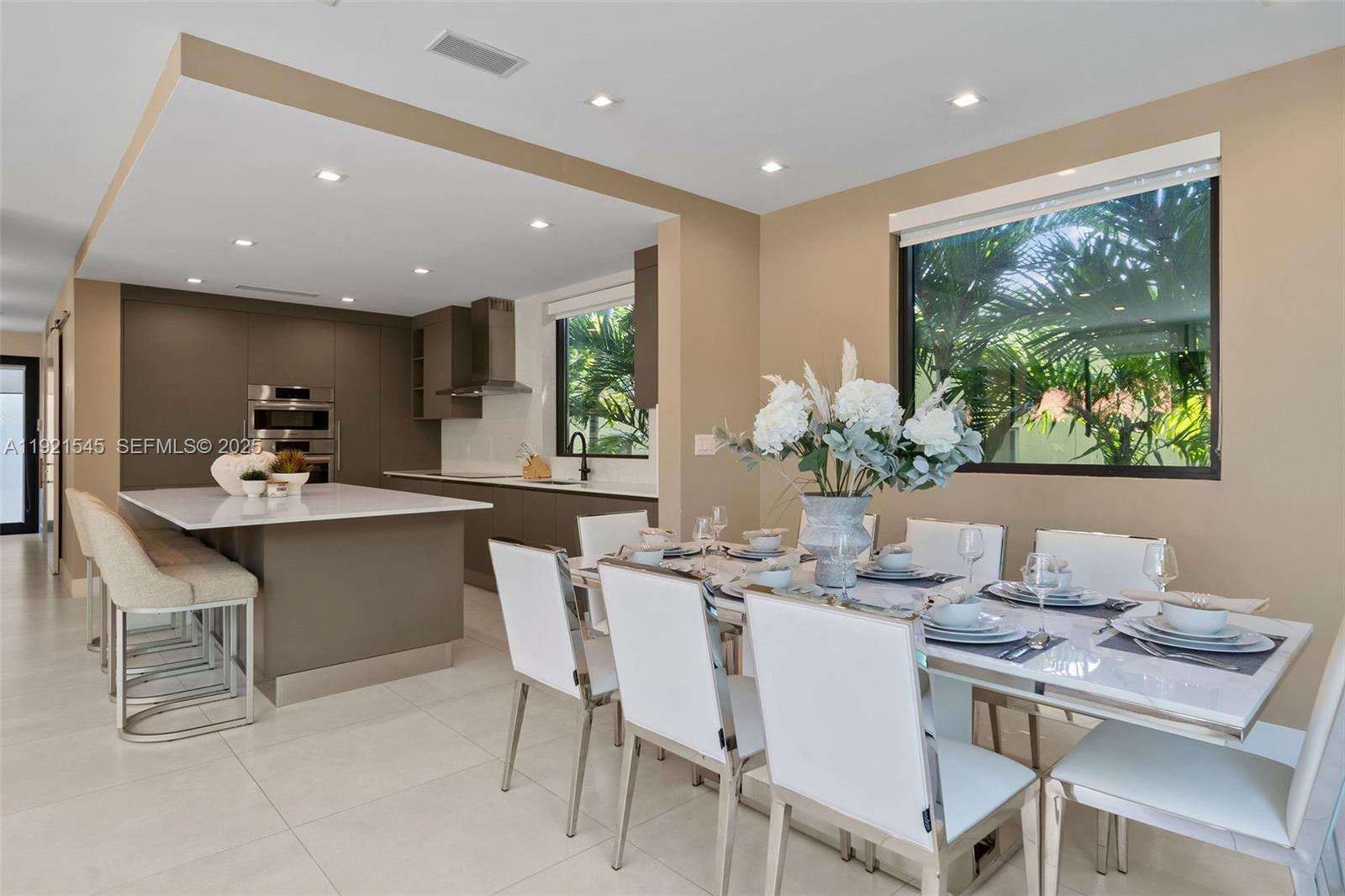 4740 Alton Road Miami Beach, FL 33140 - Photo 6 of 34 a dining room with furniture and window
