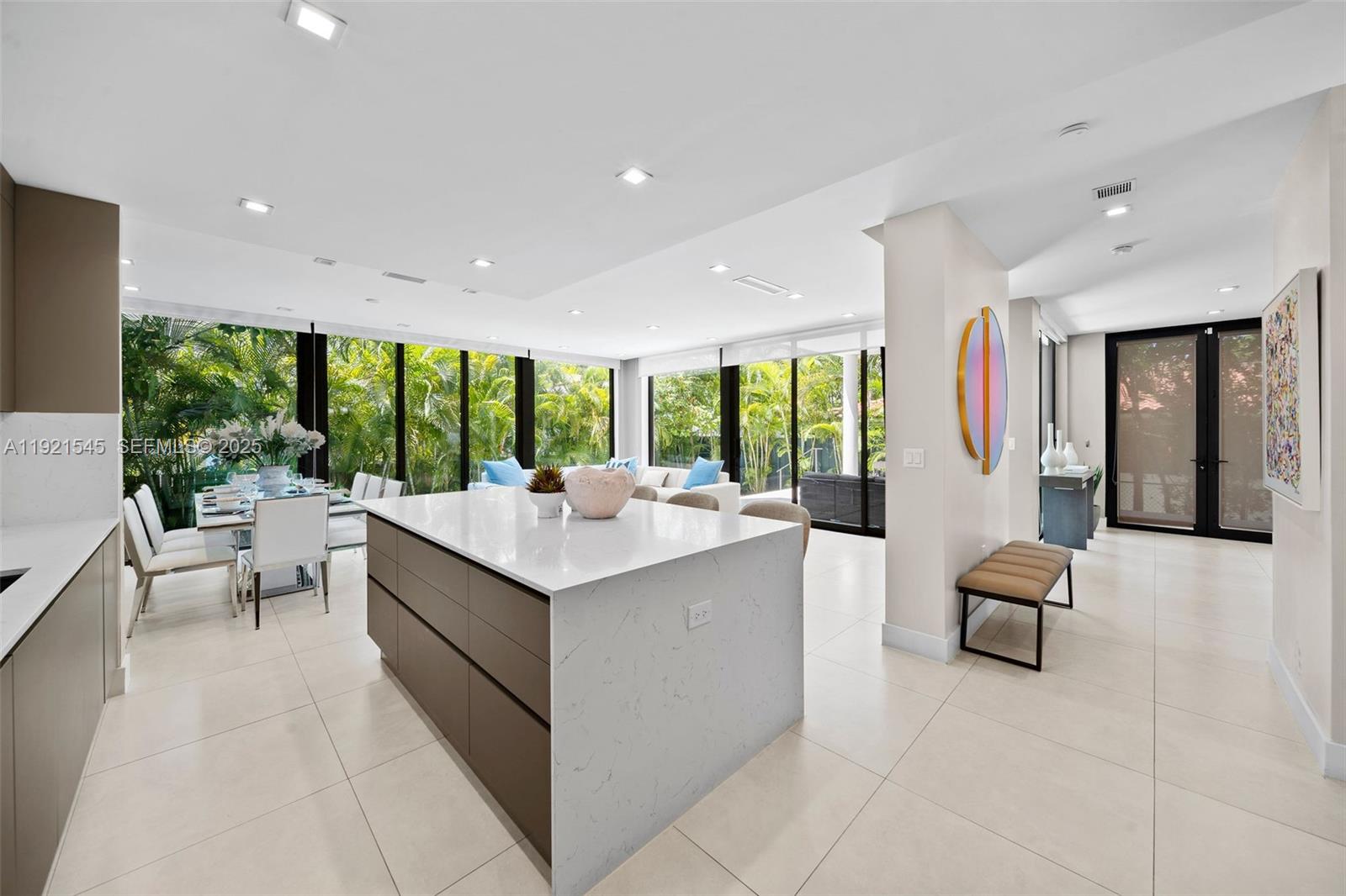 4740 Alton Road Miami Beach, FL 33140 - Photo 8 of 34 a large white kitchen with a large window