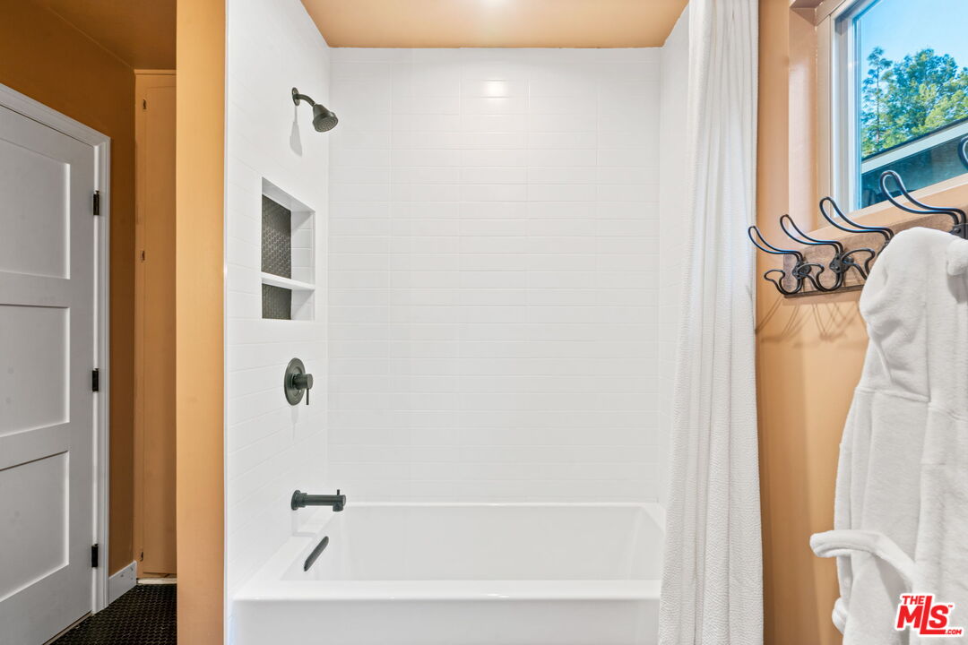 2304 Pickens Canyon Road La Crescenta, CA 91214 - Photo 16 of 37 a bathroom with a bathtub and a shower