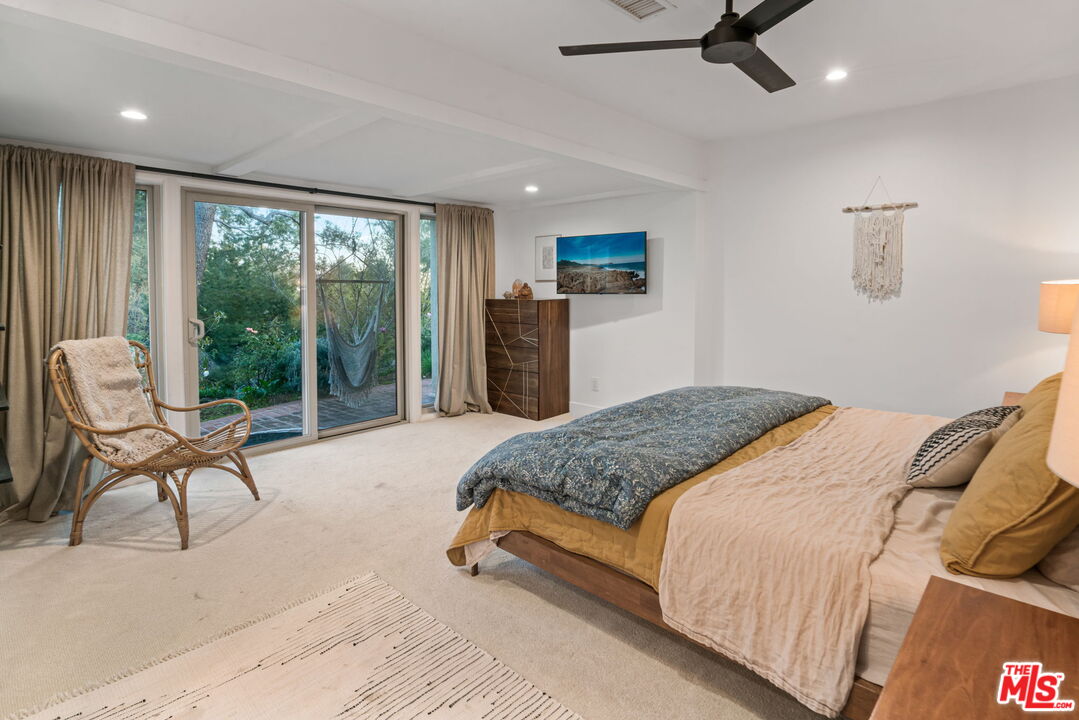 2304 Pickens Canyon Road La Crescenta, CA 91214 - Photo 18 of 37 a bedroom with a balcony a bed and a couch