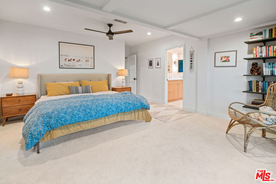 2304 Pickens Canyon Road La Crescenta, CA 91214 - Photo 19 of 37 a bedroom with a bed a table and painting on the wall