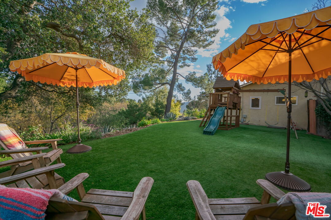 2304 Pickens Canyon Road La Crescenta, CA 91214 - Photo 27 of 37 a backyard of a house with table and chairs