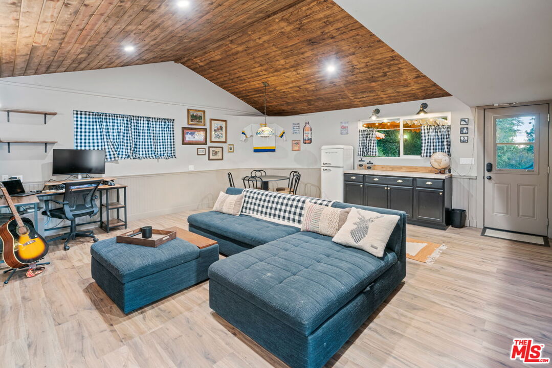 2304 Pickens Canyon Road La Crescenta, CA 91214 - Photo 29 of 37 a living room with furniture and a flat screen tv