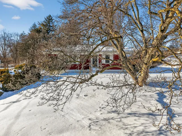 a view of snow on the side of the road