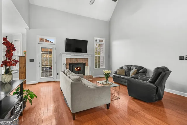 a kitchen with stainless steel appliances granite countertop a stove refrigerator sink and cabinets