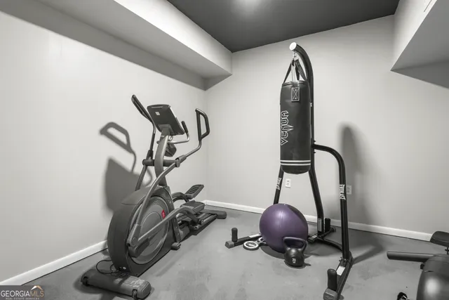 a living room with furniture and white walls