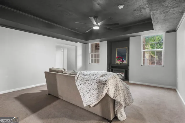 an empty room with windows and closet