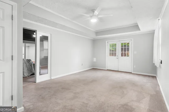 a view of an empty room with a window