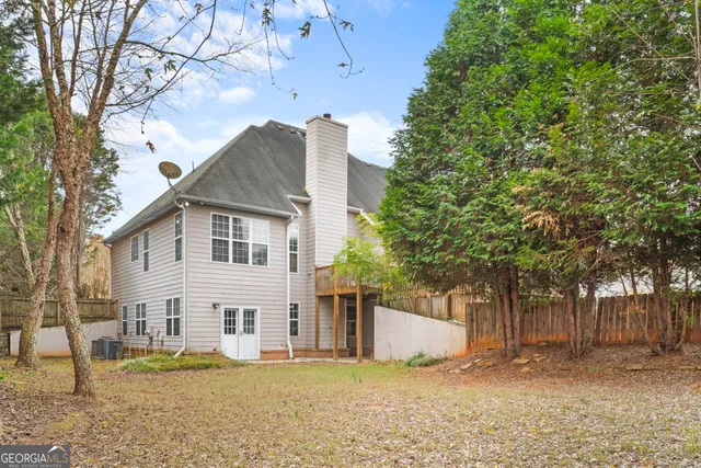 a view of a yard with a large tree