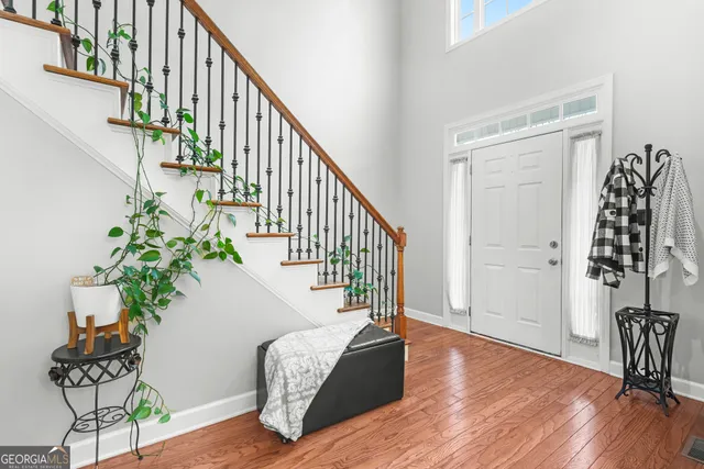 a spacious bedroom with a bed and a window