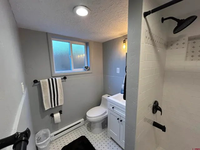 a bathroom with a toilet sink