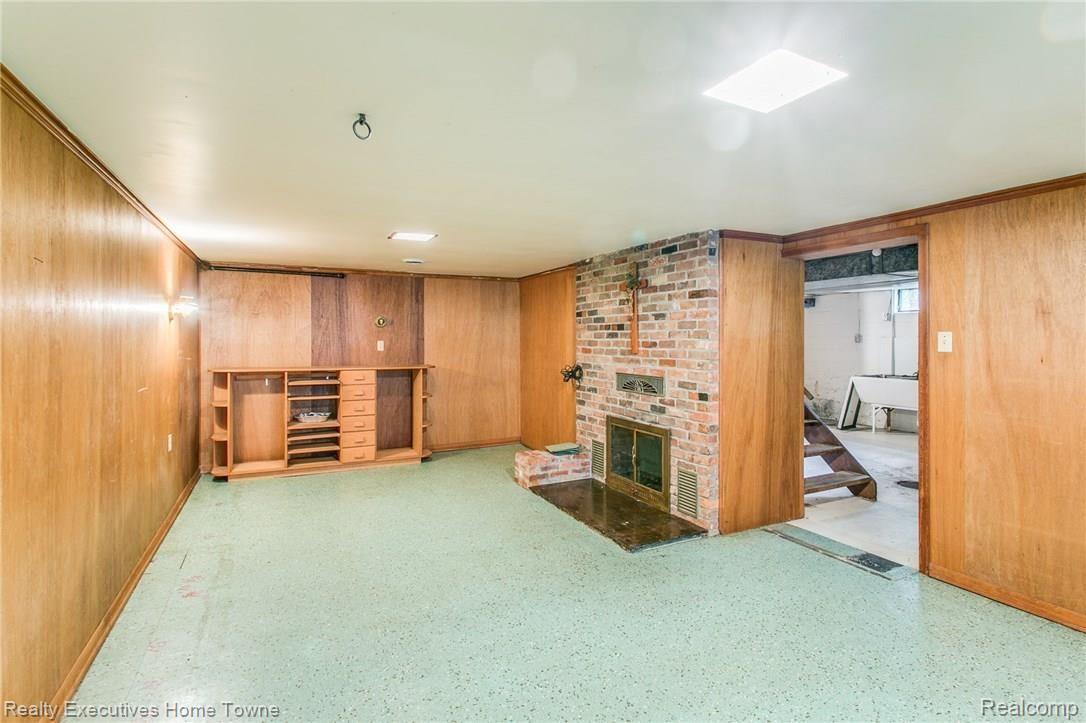 3244 Riverside Drive Port Huron, MI 48060 - Photo 15 of 23 partial finished basement with fireplace
