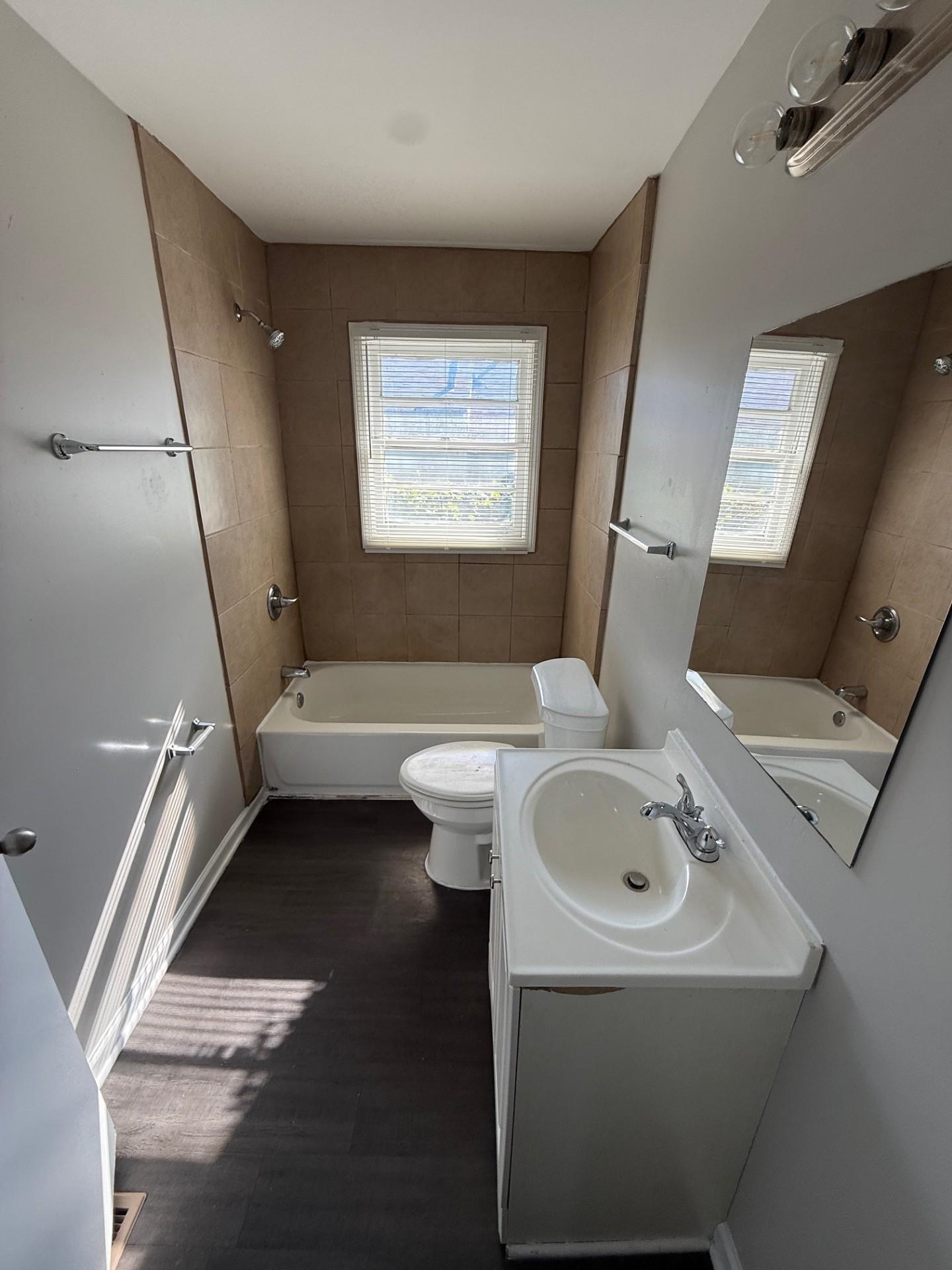 1560 Cane Road Memphis, TN 38106 - Photo 11 of 15 a bathroom with a sink and a mirror