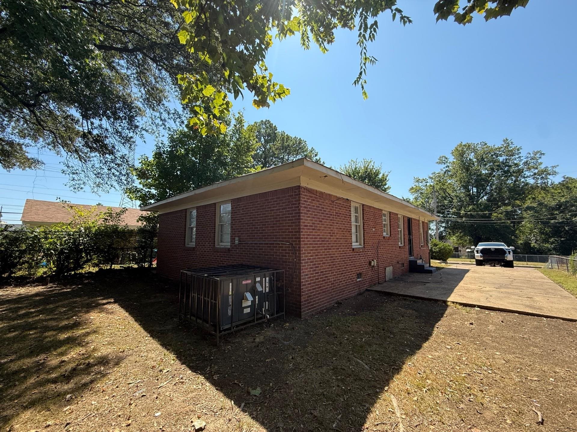1560 Cane Road Memphis, TN 38106 - Photo 4 of 15 a front view of a house with a yard