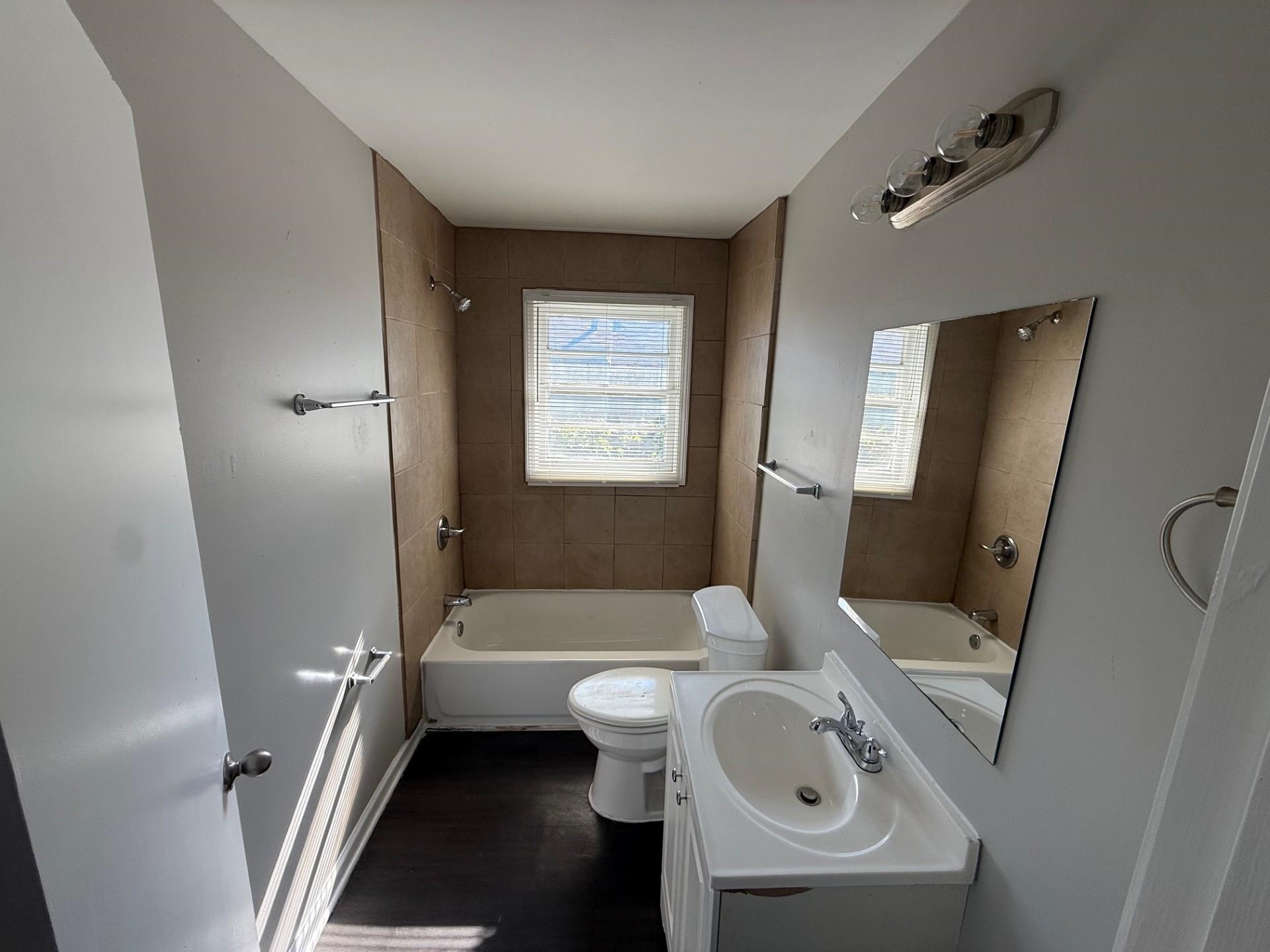 1560 Cane Road Memphis, TN 38106 - Photo 8 of 15 a bathroom with a sink toilet and shower