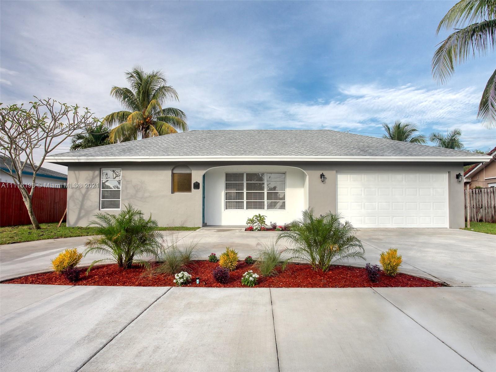 49 Southwest 12th Avenue Boca Raton, FL 33486 - Photo 1 of 30 a front view of house with an outdoor space