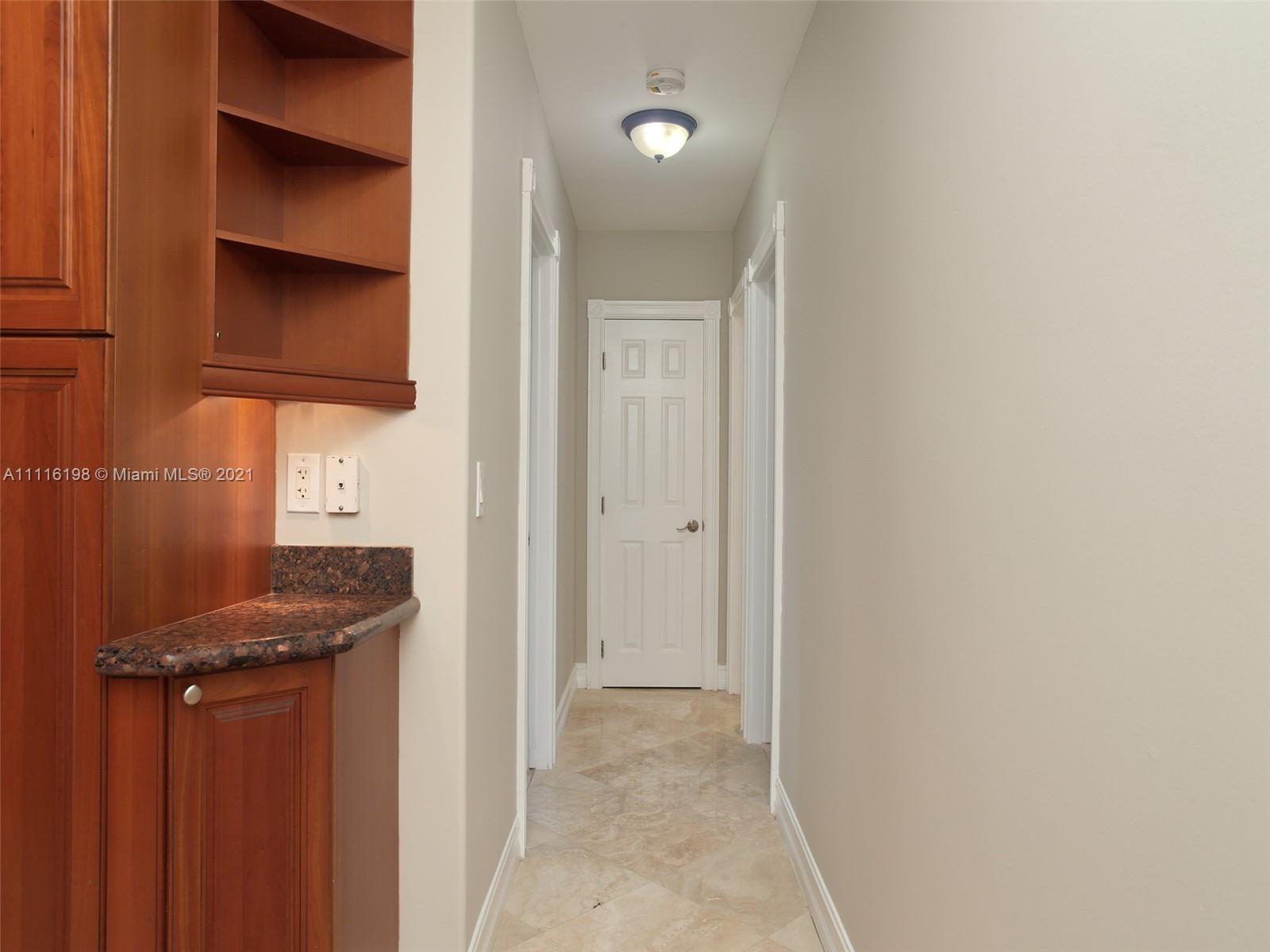 49 Southwest 12th Avenue Boca Raton, FL 33486 - Photo 19 of 30 a view of a hallway with wooden floor
