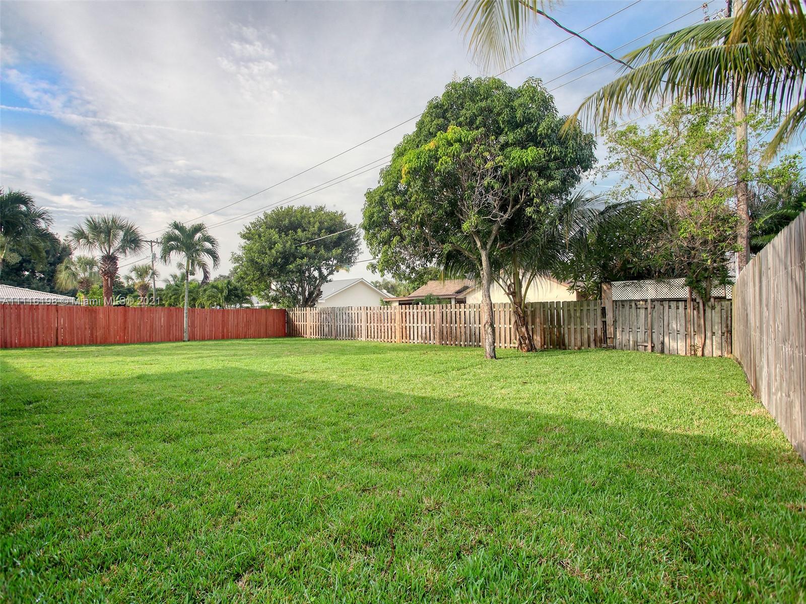 49 Southwest 12th Avenue Boca Raton, FL 33486 - Photo 28 of 30 a view of a backyard with a garden