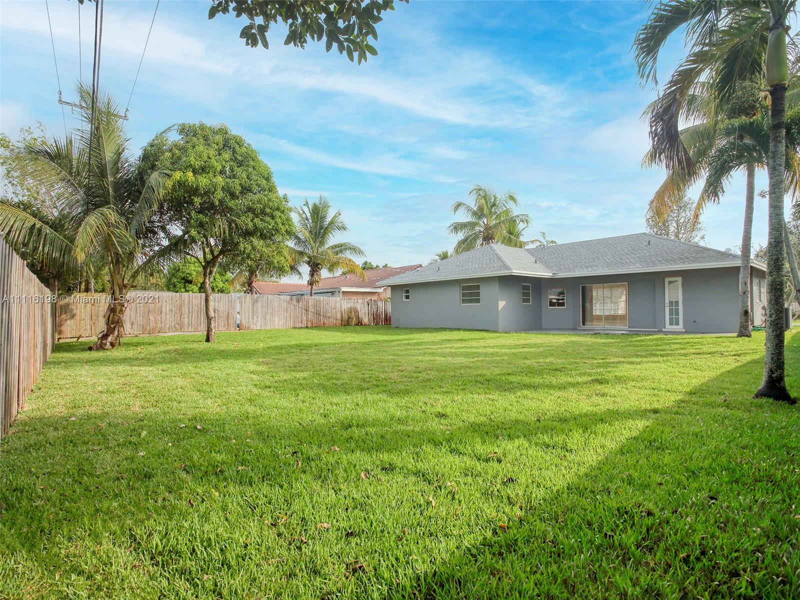 49 Southwest 12th Avenue Boca Raton, FL 33486 - Photo 29 of 30 a front view of a house with garden