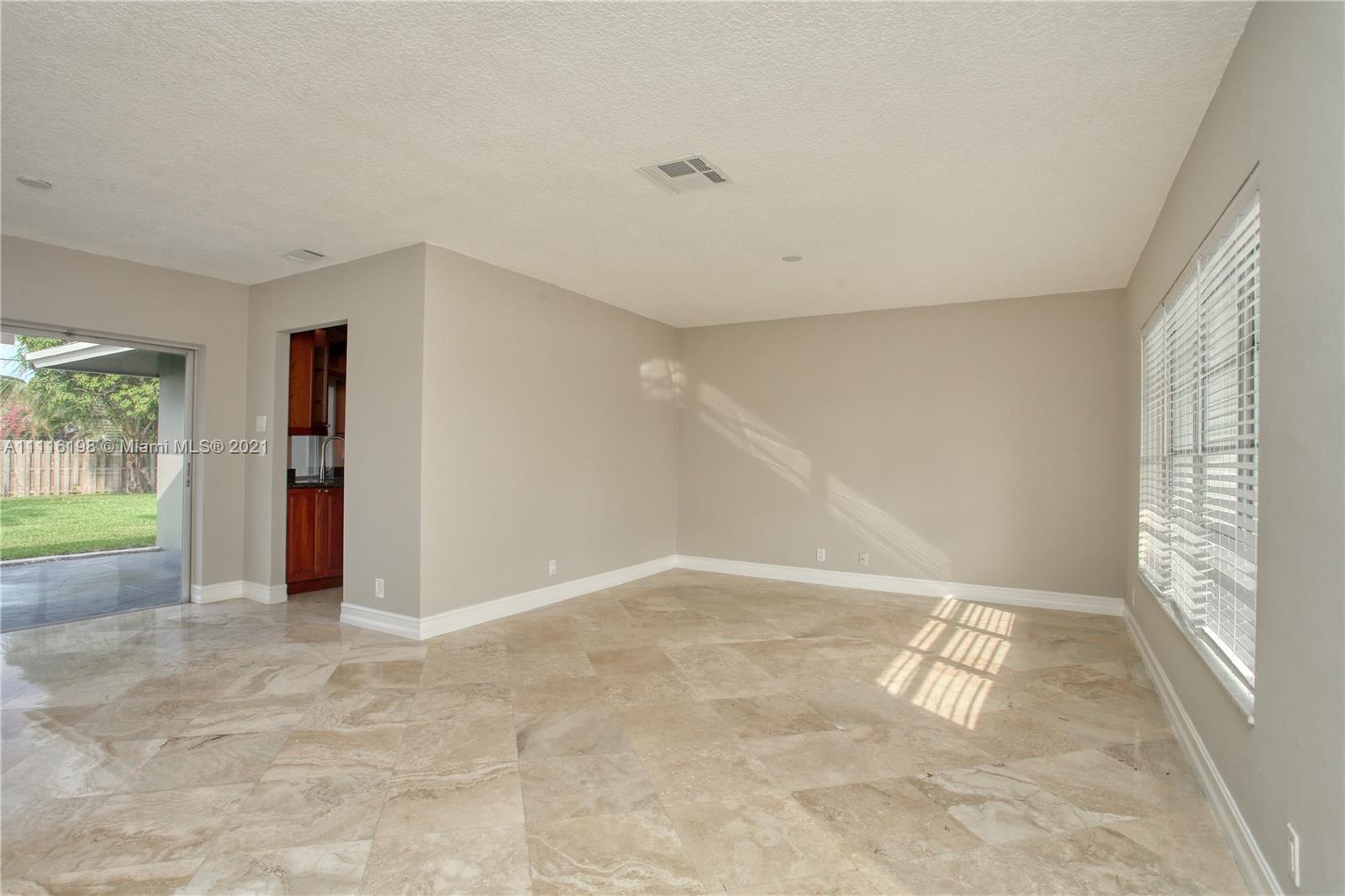 49 Southwest 12th Avenue Boca Raton, FL 33486 - Photo 6 of 30 a view of an empty room with a window