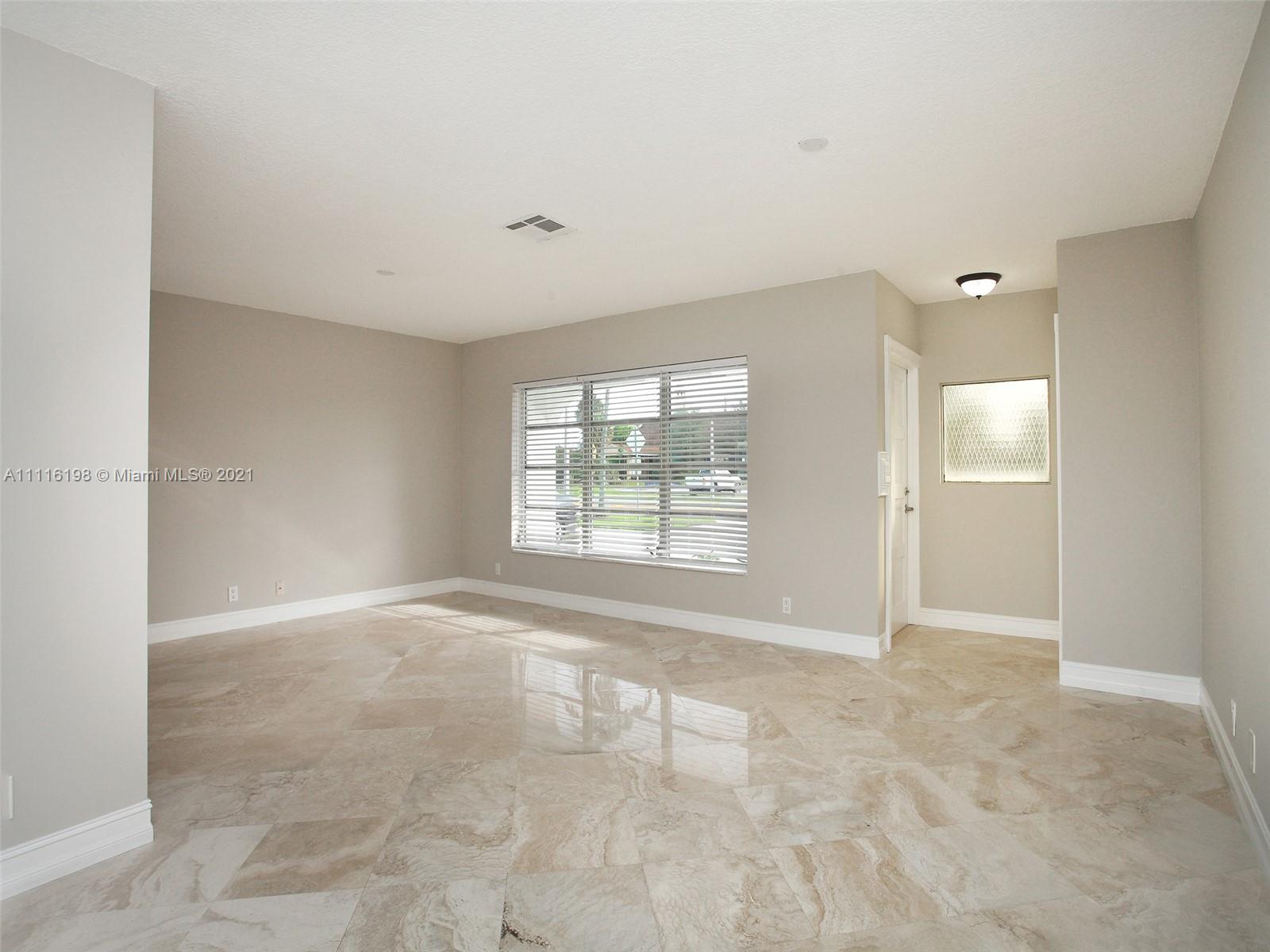 49 Southwest 12th Avenue Boca Raton, FL 33486 - Photo 7 of 30 a view of an empty room with a window