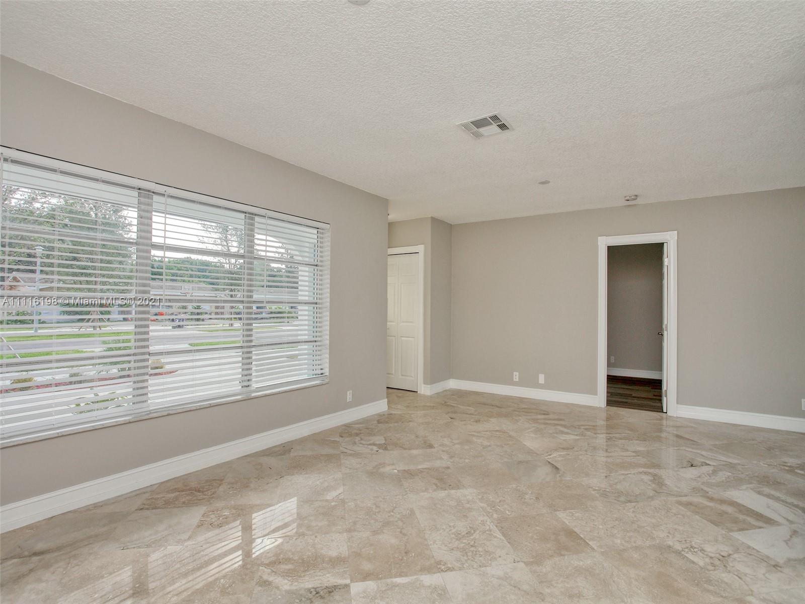 49 Southwest 12th Avenue Boca Raton, FL 33486 - Photo 8 of 30 a view of an empty room with a window