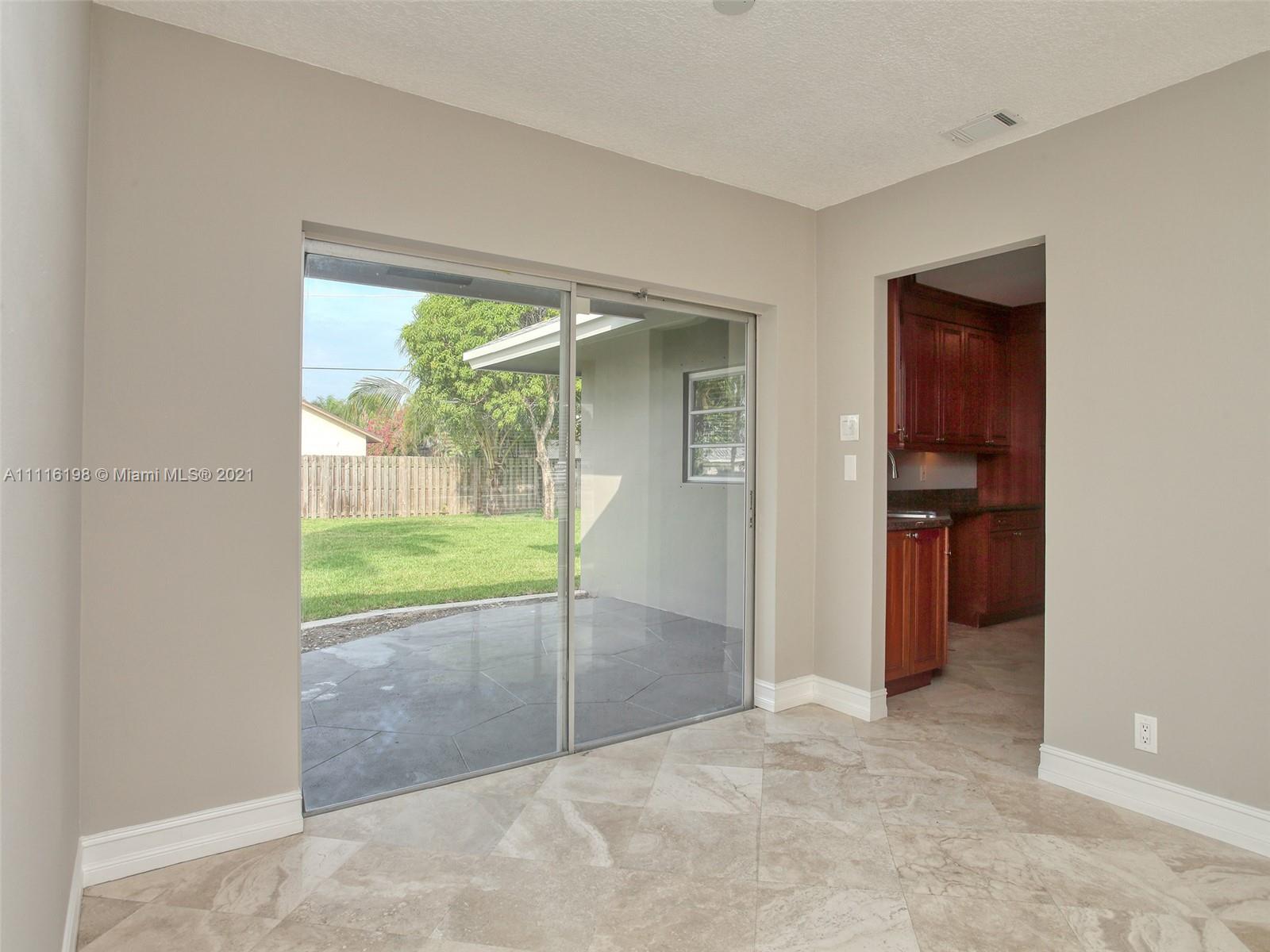 49 Southwest 12th Avenue Boca Raton, FL 33486 - Photo 9 of 30 an empty room with an outdoor view and a window