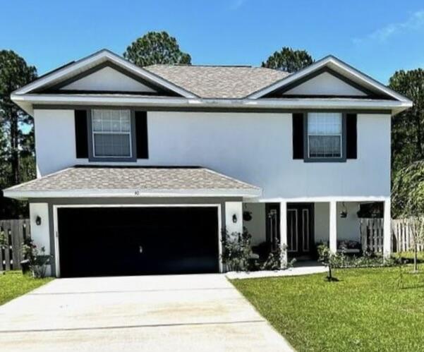 40 Red Maple Court Santa Rosa Beach, FL 32459 - Photo 1 of 1 a front view of a house with a yard