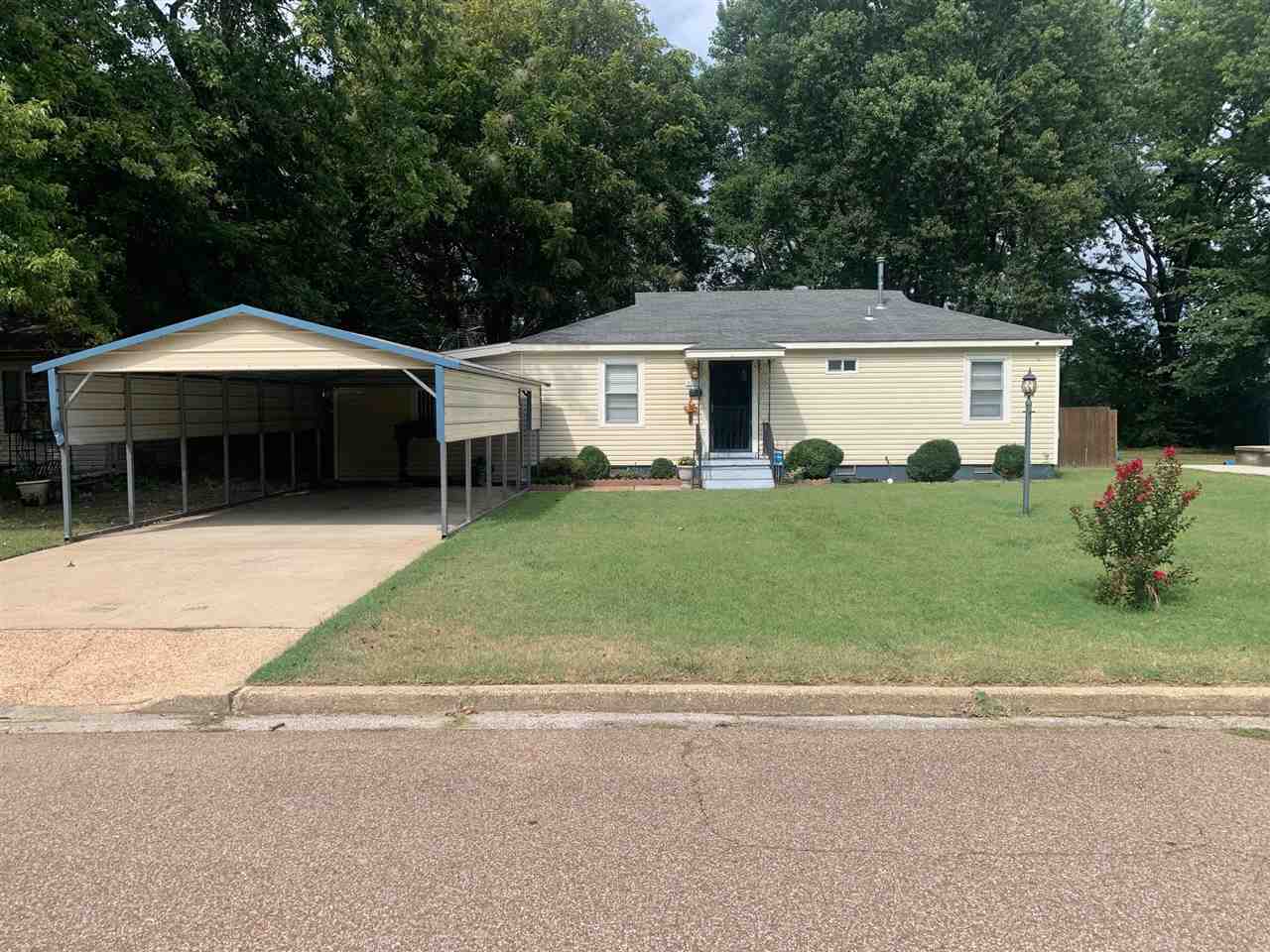 4588 Talley Road Millington, TN 38053 - Photo 1 of 17 a front view of a house with a yard and trees