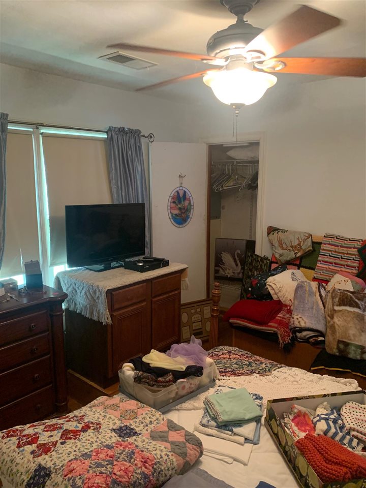 4588 Talley Road Millington, TN 38053 - Photo 11 of 17 a bedroom with bed and a chandelier