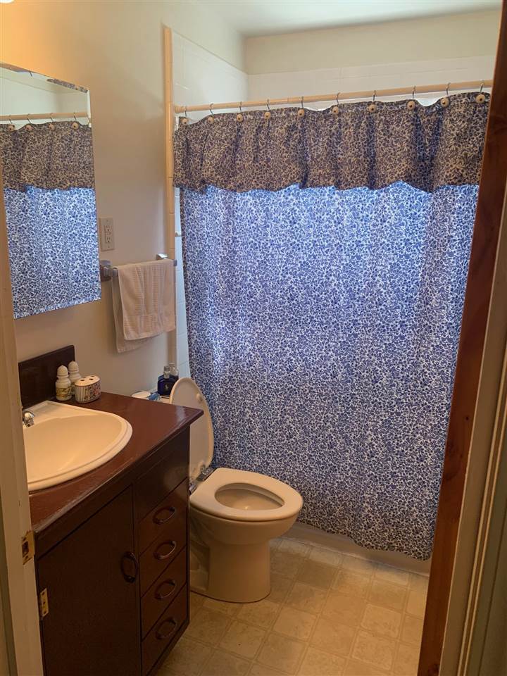 4588 Talley Road Millington, TN 38053 - Photo 13 of 17 a bathroom with a granite countertop toilet a sink and a mirror