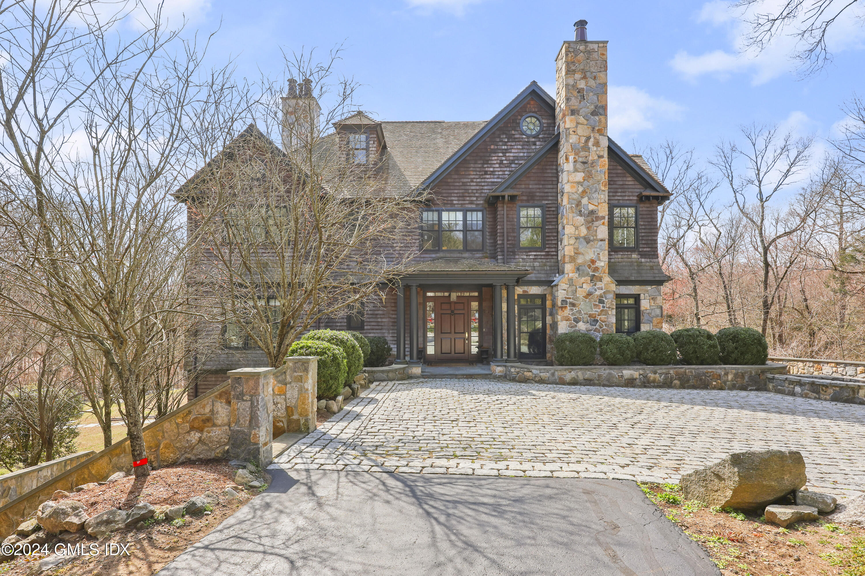 59 Cat Rock Road Cos Cob, CT 06807 - Photo 1 of 51 a front view of a house with garden