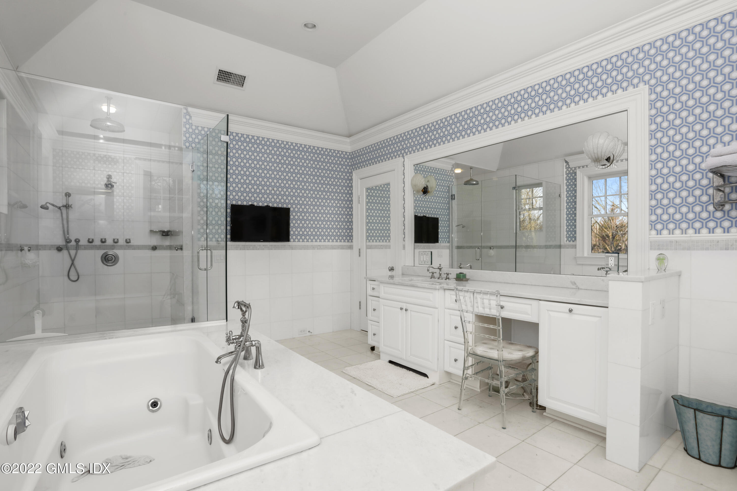 59 Cat Rock Road Cos Cob, CT 06807 - Photo 22 of 51 a spacious bathroom with a bathtub shower sink mirror and toilet