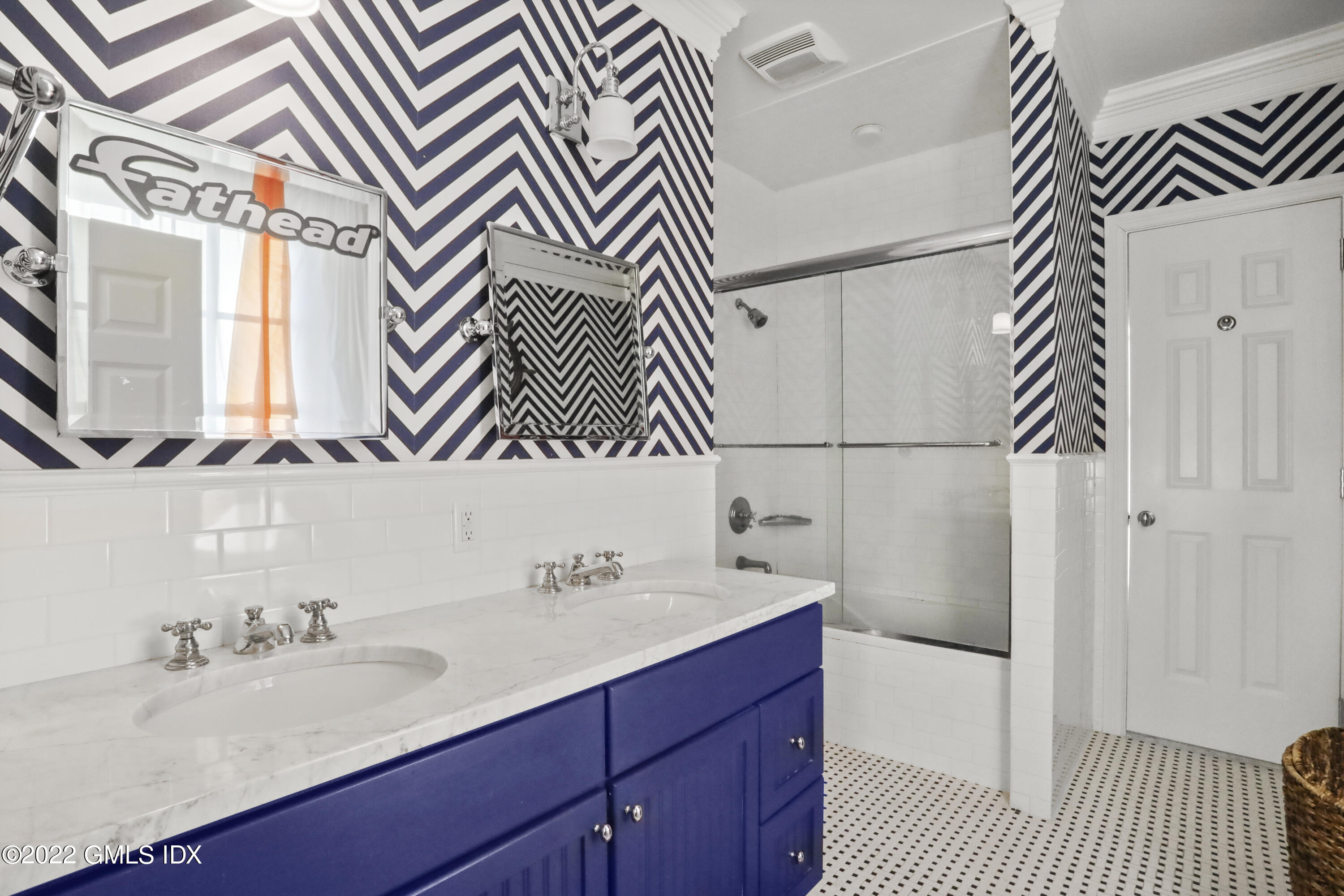 59 Cat Rock Road Cos Cob, CT 06807 - Photo 27 of 51 a bathroom with a sink and a mirror