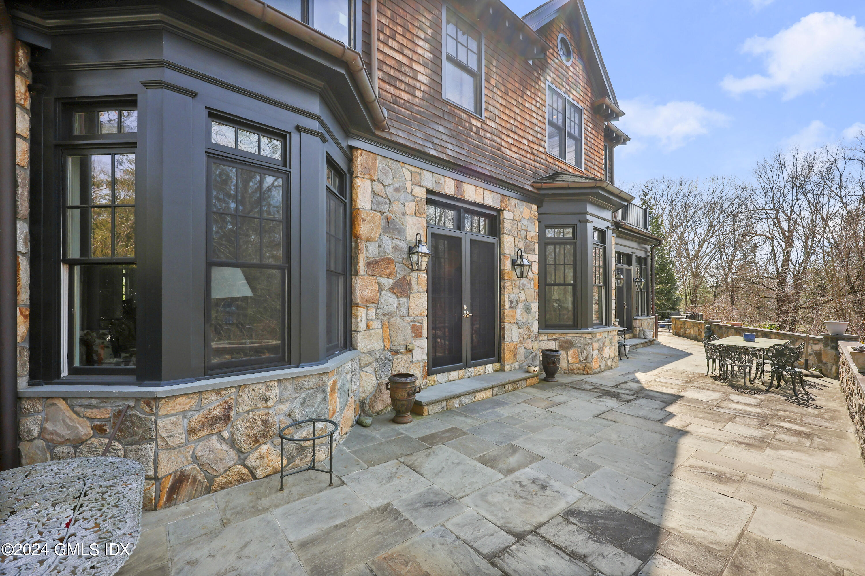 59 Cat Rock Road Cos Cob, CT 06807 - Photo 43 of 51 a view of a brick building with large windows