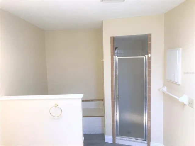 a bathroom with a tub and shower