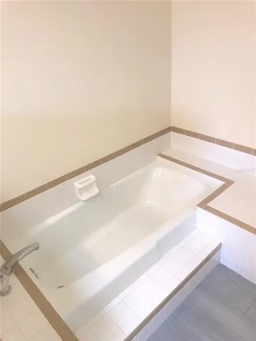 a kitchen with a sink a stove and a refrigerator