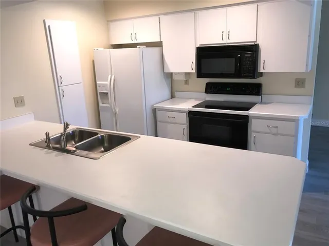 a kitchen with a stove and a microwave